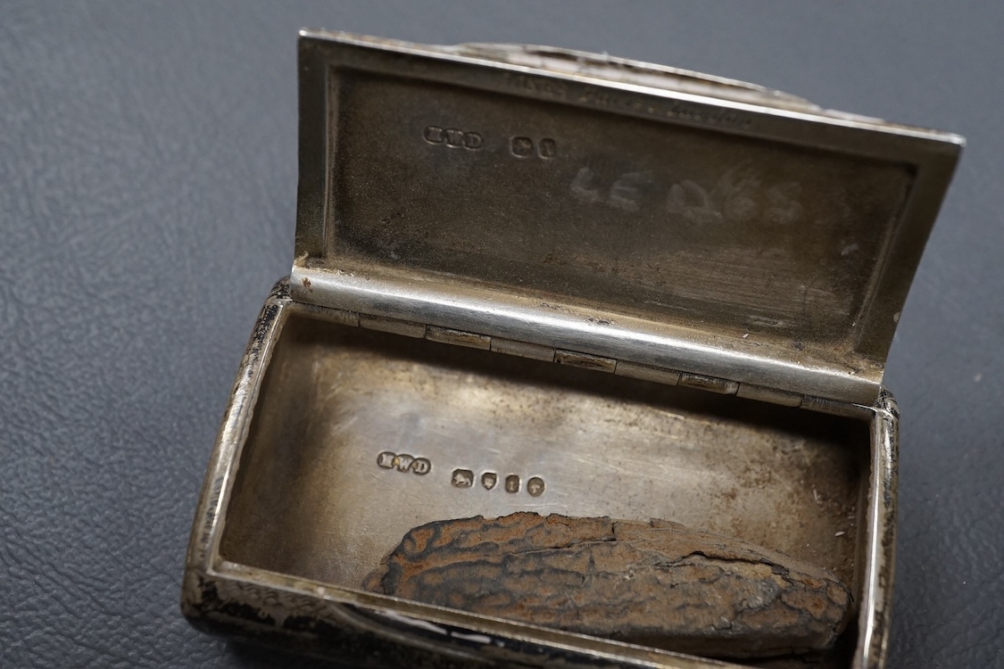 An Edwardian silver seven bar toast rack, by Mappin & Webb, Sheffield, 1902, 15.7cm, together with a George V smaller five bar toast rack, Thomas Bradbury & Sons, Sheffield, 1920, 15.6oz.